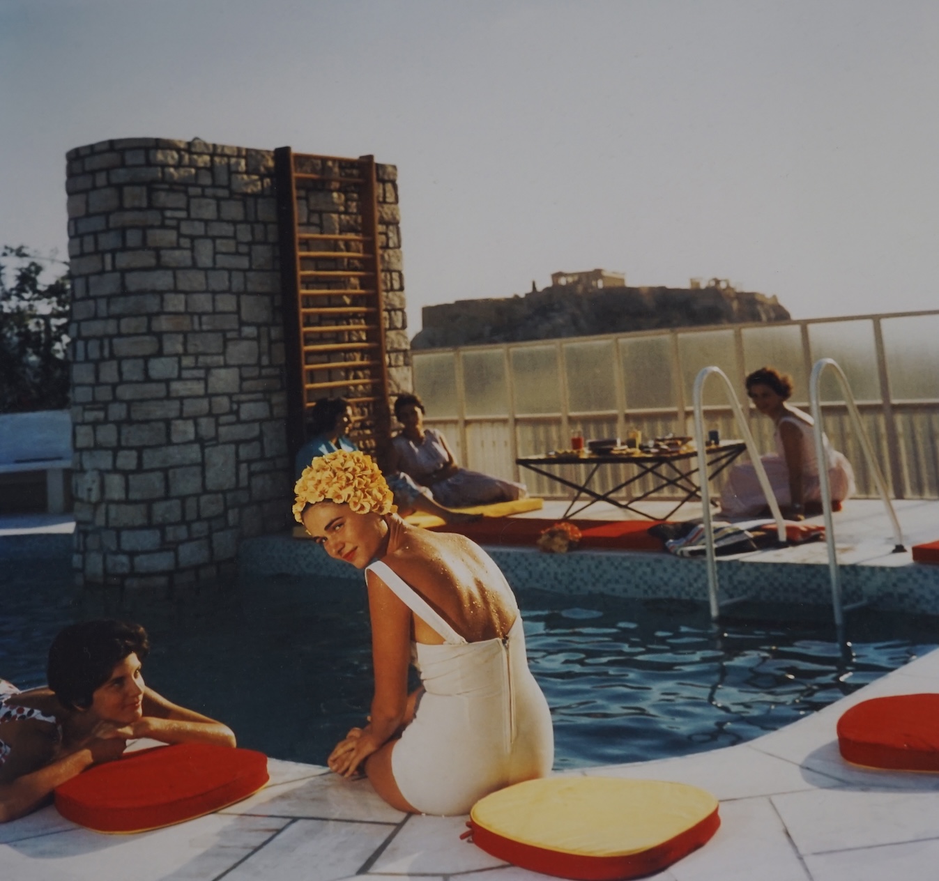 Slim Aarons (American, 1916-2006), colour photograph, 'Canellopoulos penthouse pool, (July 1961), Getty images label verso, 37 x 37cm. Condition - good